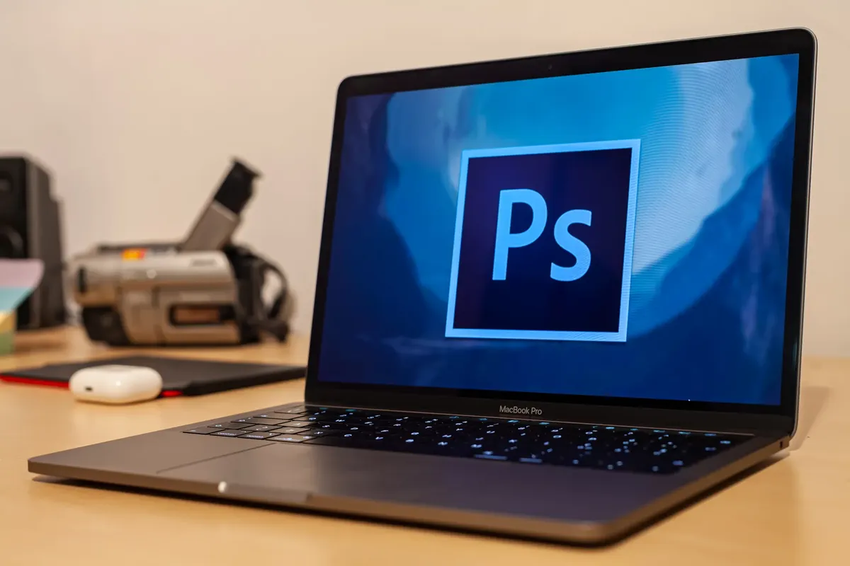 A MacBook Pro showcasing Adobe Photoshop interface, ideal for design and editing work.